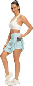 A light blue WOWENY active skort featuring ruffle pleats, a high-waisted design, and built-in shorts, ideal for pickleball and tennis.